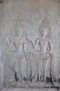 Dancing Apsaras an old Khmer art carvings on the wall in Angkor