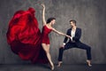 Dancing Ballet Couple, Beautiful Woman in Red Dress and Man in Suit, Ballerina in Flying Waving Fabric Royalty Free Stock Photo