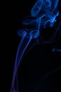 Dancing blue smoke with dark background