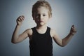 Dancing Child. Funny Little Boy.Handsome Boy try to dance. Blue background Royalty Free Stock Photo