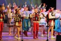 Dancing children in traditional costumes