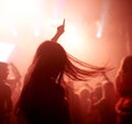 Dancing, club and back of woman at a concert, disco event or psychedelic trance festival. Night, energy and female Royalty Free Stock Photo