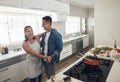 Dancing, cooking and couple in kitchen together with healthy food, relationship and bonding in home. Romance, happy man Royalty Free Stock Photo