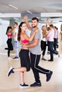 Dancing couples learning salsa at dance class Royalty Free Stock Photo