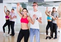 Dancing couples learning salsa at dance class Royalty Free Stock Photo