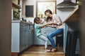 Dancing the day away. a mother playing with her little daughter in the kitchen at home. Royalty Free Stock Photo