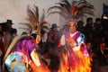 Dancing with fire and masks in the procession of the vigen del carmen in the streets at night june 2018 paucartambo cuzco