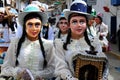 Dancing devotees with mask in the streets of the town the procession of the Virgin of Carmen -.Catholic religion
