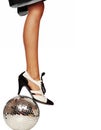 Dancing feet, shoes on a disco ball, isolated against white background Royalty Free Stock Photo