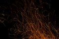 Dancing flames and sparks isolated on black Royalty Free Stock Photo