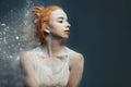 Redhead woman dancer in dust Royalty Free Stock Photo