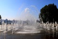 Dancing fountains in park against wide river. Spring, summer street in city Dnepr, Ukraine, cityscape Royalty Free Stock Photo