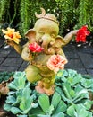 Dancing Ganesh statue holding hibiscus flowers, Thailand Royalty Free Stock Photo