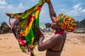 Dancing Ghana woman on the beautiful beach of Axim