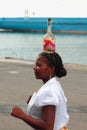 Dancing girl with bottle on head. Toamasina, Madagascar