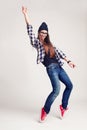 Dancing hipster girl in glasses and black beanie Royalty Free Stock Photo