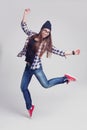 Dancing hipster girl in glasses and black beanie Royalty Free Stock Photo