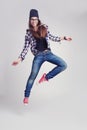 Dancing hipster girl in glasses and black beanie Royalty Free Stock Photo