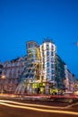 The Dancing House or Fred and Ginger building in Prague. Long exposure night scene of building with car light trail Royalty Free Stock Photo