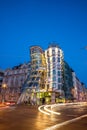 The Dancing House or Fred and Ginger building in Prague. Long exposure night scene of building with car light trail Royalty Free Stock Photo