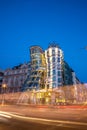 The Dancing House or Fred and Ginger building in Prague. Long exposure night scene of building with car light trail Royalty Free Stock Photo