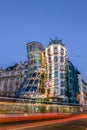 The Dancing House or Fred and Ginger building in Prague. Long exposure night scene of building with car light trail Royalty Free Stock Photo