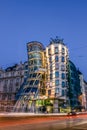 The Dancing House or Fred and Ginger building in Prague. Long exposure night scene of building with car light trail Royalty Free Stock Photo