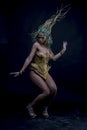 Dancing, Latin woman with green hair and gold costume with handmade flourishes, fantasy image and tale