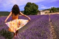 Woman wearing a floating dress in a lavender field Royalty Free Stock Photo