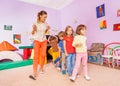 Dancing lesson with kids repeat after teacher