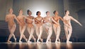 Dancing is like dreaming with your feet. a group of ballet dancers practicing a routine on a stage. Royalty Free Stock Photo