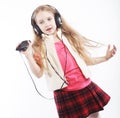 Dancing little girl headphones music singing on white background Royalty Free Stock Photo