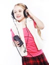 Dancing little girl headphones music singing on white background Royalty Free Stock Photo