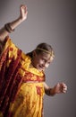 dancing little girl in traditional Indian clothing and jeweleries