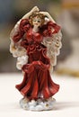 A dancing little porcelain figure in red dress