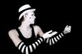 Dancing mime in white hat
