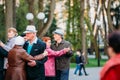 Dancing Pair In Years On Outdoor Dance Floor Among Dancing Solus