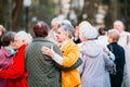 Dancing Pair In Years On Outdoor Dance Floor Among Dancing Solus