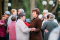 Dancing Pair In Years On Outdoor Dance Floor Among Dancing Solus