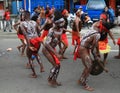 Dancing Papuan men and women in traditional clothes and face paintings from Kaimana