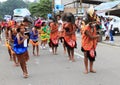 Dancing Papuan women in traditional clothes and face paintings