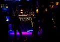 Dancing people in an underground club. dance floor with people dancing under the colorful lights