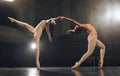 Dancing is the poetry of the foot. a group of ballet dancers practicing a routine on stage. Royalty Free Stock Photo