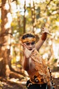 Dancing pose from a scary Balinese man with a golden necklace and crown on her body shirtless