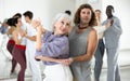 Dancing positive couples learning salsa Royalty Free Stock Photo