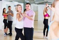 Dancing couples learning salsa at dance class Royalty Free Stock Photo