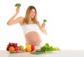 Dancing pregnant woman with fruits and vegetables Royalty Free Stock Photo