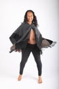 Dancing pregnant woman in grey poncho Royalty Free Stock Photo