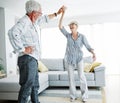 dancing senior woman home love couple happy man together retirement smiling lifestyle home fun elderly Royalty Free Stock Photo