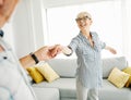 dancing senior woman home love couple happy man together retirement smiling lifestyle home fun elderly Royalty Free Stock Photo